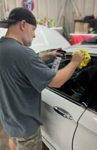 Man detailing vehicle